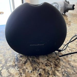 SAJE aroma breeze diffuser plus a bunch of essential oils
